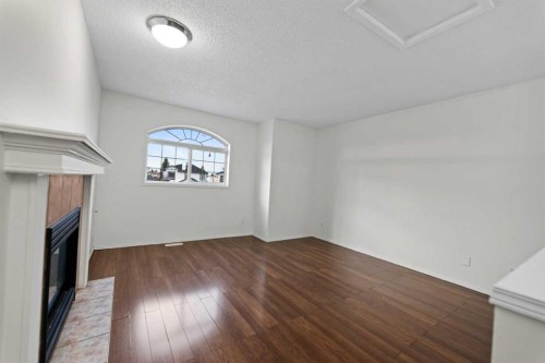 61 Applemont Place Se, Calgary, AB - Indoor Photo Showing Other Room With Fireplace
