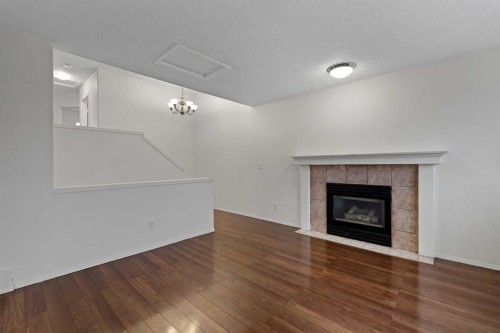 61 Applemont Place Se, Calgary, AB - Indoor Photo Showing Living Room With Fireplace