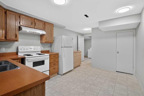 34 Marbank Place Ne, Calgary, AB - Indoor Photo Showing Kitchen With Double Sink