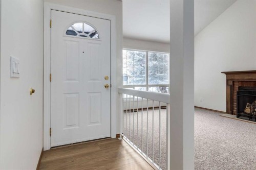 60 Bedford Circle Ne, Calgary, AB - Indoor Photo Showing Other Room With Fireplace