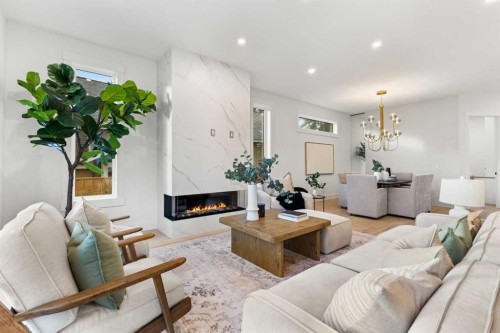 725 18 Avenue Nw, Calgary, AB - Indoor Photo Showing Living Room With Fireplace