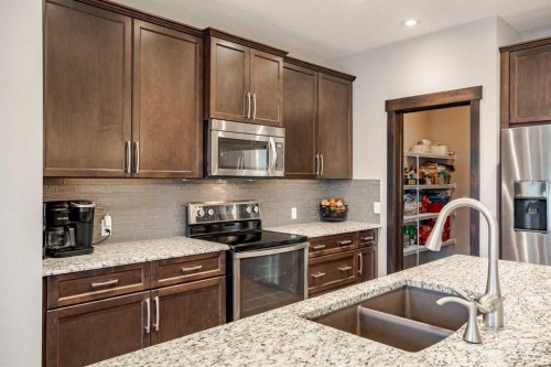 355 Evanston Way Nw, Calgary, AB - Indoor Photo Showing Kitchen With Double Sink With Upgraded Kitchen