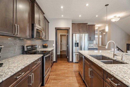 355 Evanston Way Nw, Calgary, AB - Indoor Photo Showing Kitchen With Double Sink With Upgraded Kitchen