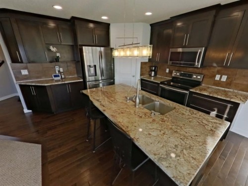 656 Cranston Drive Se, Calgary, AB - Indoor Photo Showing Kitchen With Double Sink With Upgraded Kitchen