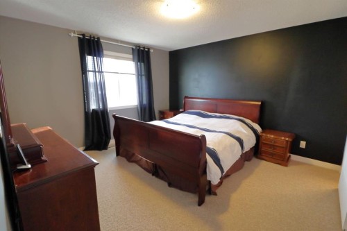 656 Cranston Drive Se, Calgary, AB - Indoor Photo Showing Bedroom