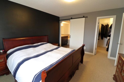 656 Cranston Drive Se, Calgary, AB - Indoor Photo Showing Bedroom