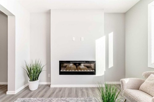 270 Sora Way Se, Calgary, AB - Indoor Photo Showing Living Room With Fireplace