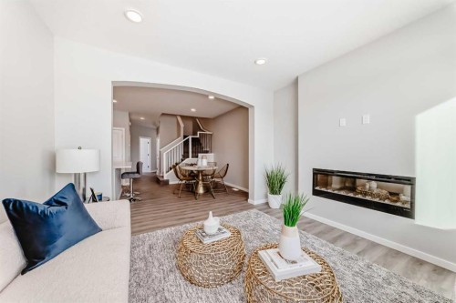 270 Sora Way Se, Calgary, AB - Indoor Photo Showing Living Room With Fireplace