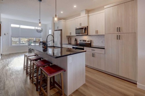 1601 Chinook Gate Drive Sw, Airdrie, AB - Indoor Photo Showing Kitchen With Upgraded Kitchen