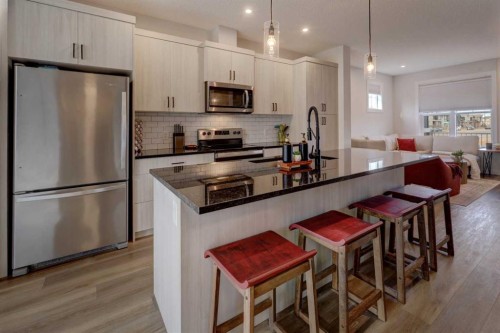 1601 Chinook Gate Drive Sw, Airdrie, AB - Indoor Photo Showing Kitchen With Upgraded Kitchen