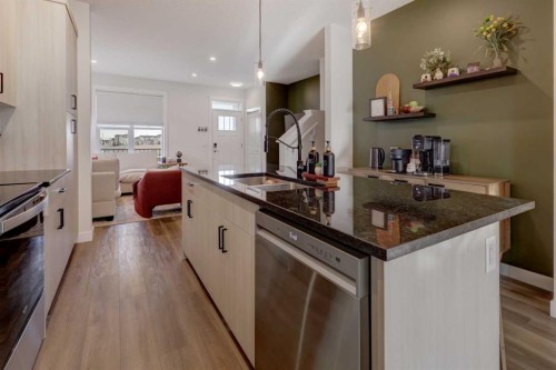 1601 Chinook Gate Drive Sw, Airdrie, AB - Indoor Photo Showing Kitchen With Upgraded Kitchen