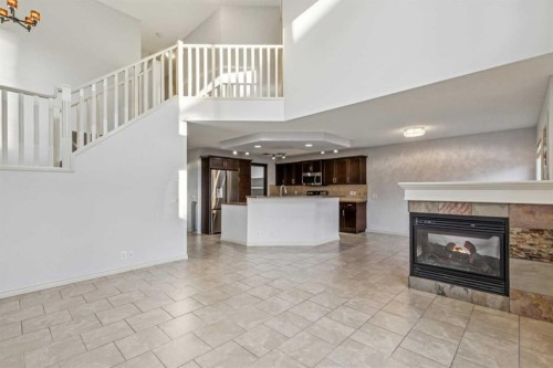 305 Tuscany Vista Road Nw, Calgary, AB - Indoor With Fireplace