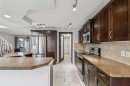 305 Tuscany Vista Road Nw, Calgary, AB  - Indoor Photo Showing Kitchen With Double Sink 