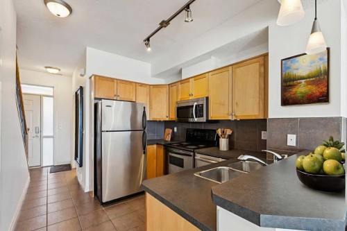 15-117 Rockyledge View Nw, Calgary, AB - Indoor Photo Showing Kitchen With Double Sink