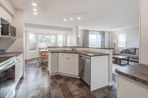 45 Cougarstone Place Sw, Calgary, AB - Indoor Photo Showing Kitchen With Double Sink