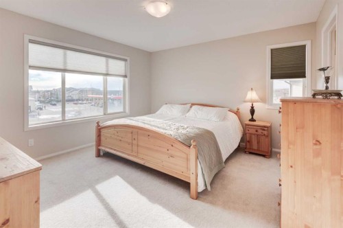 45 Cougarstone Place Sw, Calgary, AB - Indoor Photo Showing Bedroom