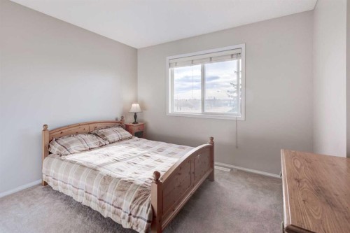 45 Cougarstone Place Sw, Calgary, AB - Indoor Photo Showing Bedroom