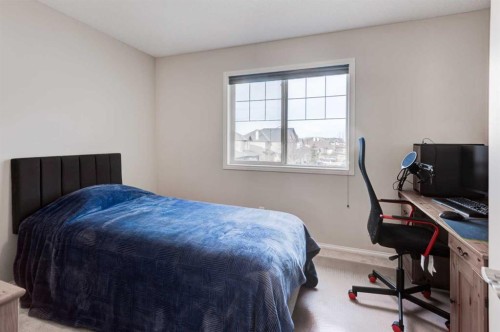 45 Cougarstone Place Sw, Calgary, AB - Indoor Photo Showing Bedroom