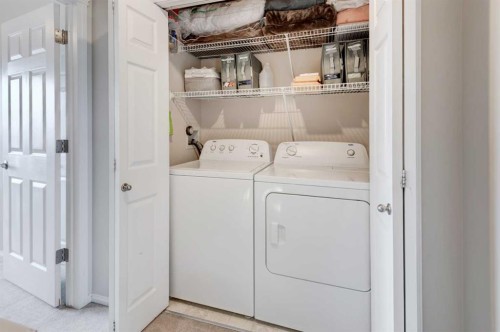 45 Cougarstone Place Sw, Calgary, AB - Indoor Photo Showing Laundry Room
