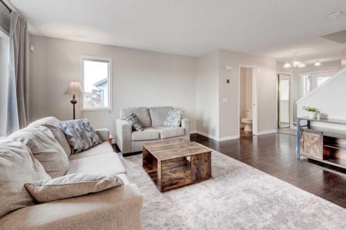 45 Cougarstone Place Sw, Calgary, AB - Indoor Photo Showing Living Room