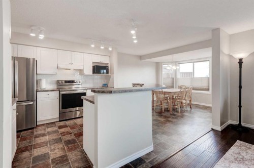 45 Cougarstone Place Sw, Calgary, AB - Indoor Photo Showing Kitchen With Upgraded Kitchen
