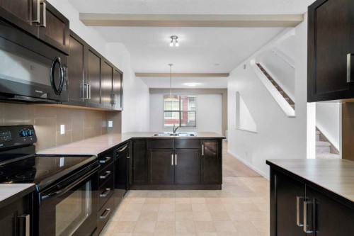 114 New Brighton Landing Se, Calgary, AB - Indoor Photo Showing Kitchen With Double Sink