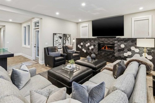 92 Crestridge View Sw, Calgary, AB - Indoor Photo Showing Living Room With Fireplace