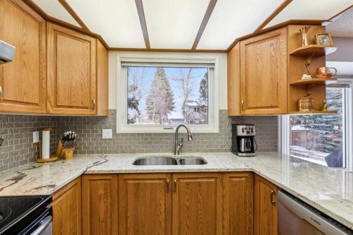 212 Oakside Circle Sw, Calgary, AB - Indoor Photo Showing Kitchen With Double Sink