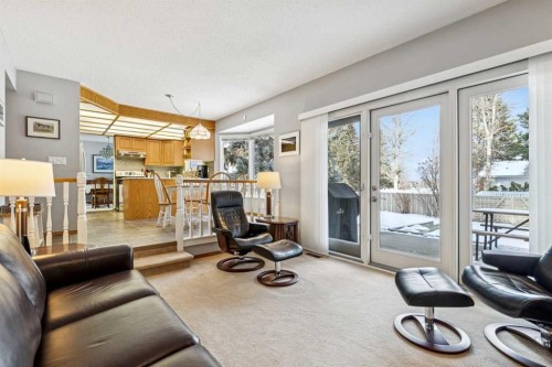 212 Oakside Circle Sw, Calgary, AB - Indoor Photo Showing Living Room