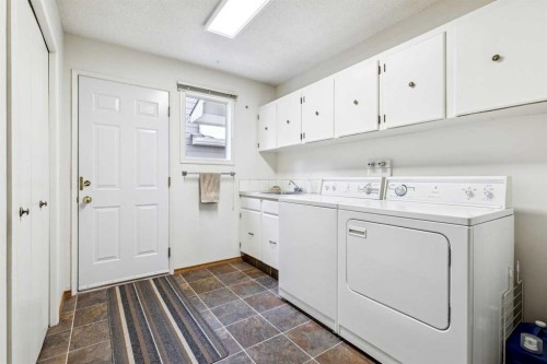 212 Oakside Circle Sw, Calgary, AB - Indoor Photo Showing Laundry Room