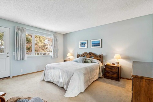 212 Oakside Circle Sw, Calgary, AB - Indoor Photo Showing Bedroom