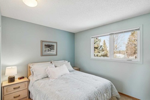 212 Oakside Circle Sw, Calgary, AB - Indoor Photo Showing Bedroom