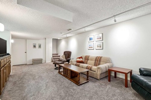 212 Oakside Circle Sw, Calgary, AB - Indoor Photo Showing Other Room