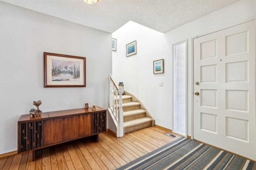 212 Oakside Circle Sw, Calgary, AB - Indoor Photo Showing Other Room
