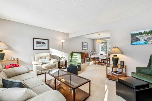 212 Oakside Circle Sw, Calgary, AB - Indoor Photo Showing Living Room
