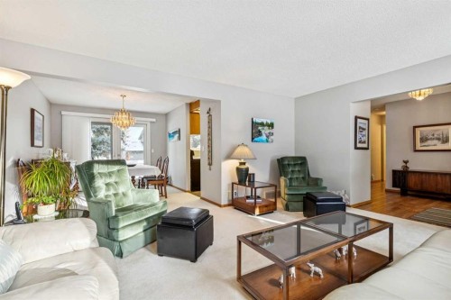 212 Oakside Circle Sw, Calgary, AB - Indoor Photo Showing Living Room