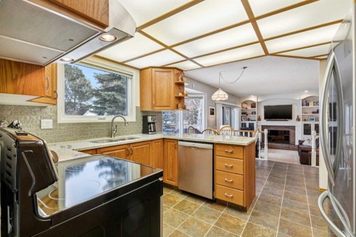 212 Oakside Circle Sw, Calgary, AB - Indoor Photo Showing Kitchen With Double Sink