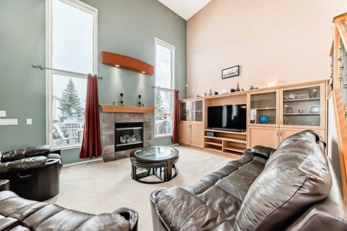 158 Invermere Drive, Chestermere, AB - Indoor Photo Showing Living Room With Fireplace