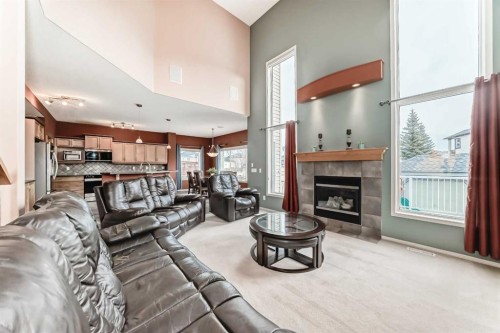 158 Invermere Drive, Chestermere, AB - Indoor Photo Showing Living Room With Fireplace