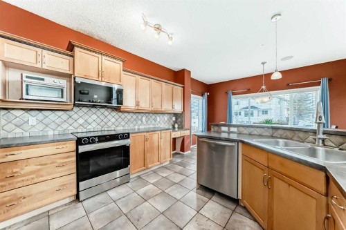 158 Invermere Drive, Chestermere, AB - Indoor Photo Showing Kitchen With Double Sink