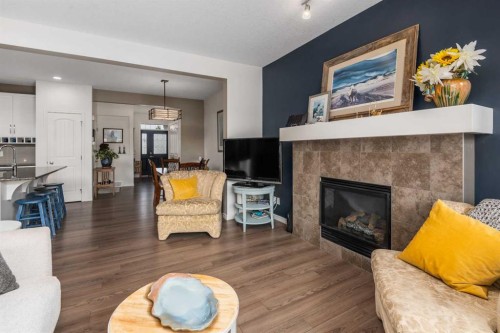 390 River Heights Crescent, Cochrane, AB - Indoor Photo Showing Living Room With Fireplace