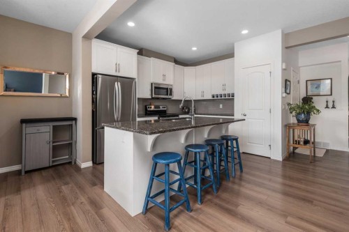 390 River Heights Crescent, Cochrane, AB - Indoor Photo Showing Kitchen With Stainless Steel Kitchen With Upgraded Kitchen