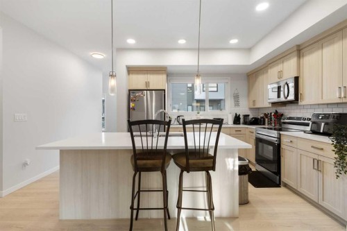 405-20295 Seton Way Se, Calgary, AB - Indoor Photo Showing Kitchen With Upgraded Kitchen