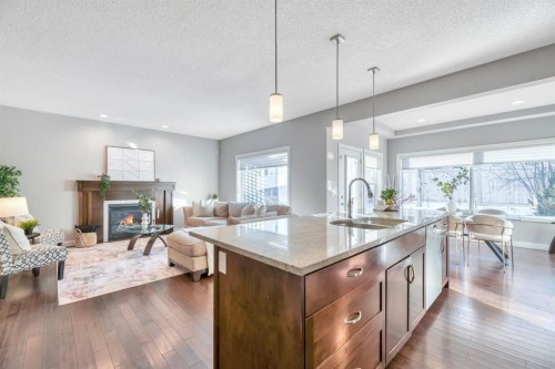 175 Everbrook Drive Sw, Calgary, AB - Indoor Photo Showing Kitchen With Fireplace With Upgraded Kitchen