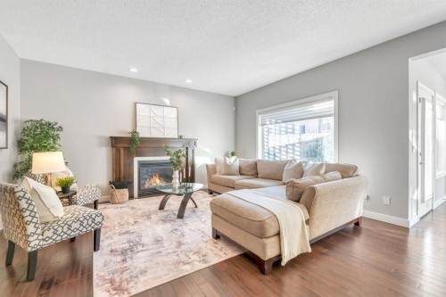 175 Everbrook Drive Sw, Calgary, AB - Indoor Photo Showing Living Room With Fireplace