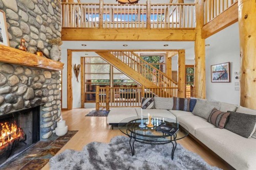 24 Blue Grouse Ridge, Canmore, AB - Indoor Photo Showing Living Room With Fireplace