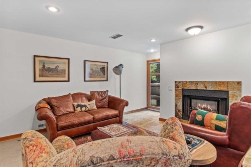 24 Blue Grouse Ridge, Canmore, AB - Indoor Photo Showing Living Room With Fireplace