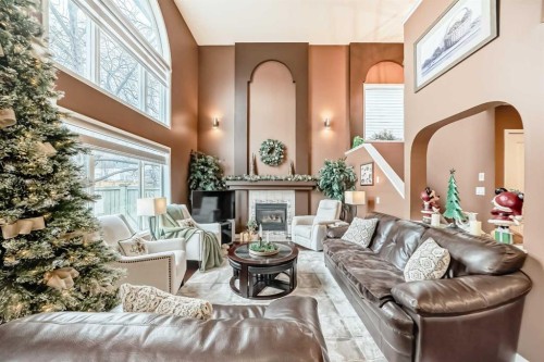 9834 Hidden Valley Drive Nw, Calgary, AB - Indoor Photo Showing Living Room With Fireplace