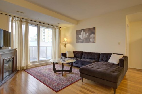 1406-683 10 Street Sw, Calgary, AB - Indoor Photo Showing Living Room With Fireplace