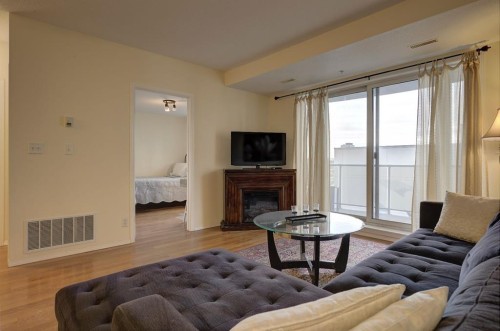 1406-683 10 Street Sw, Calgary, AB - Indoor Photo Showing Living Room With Fireplace